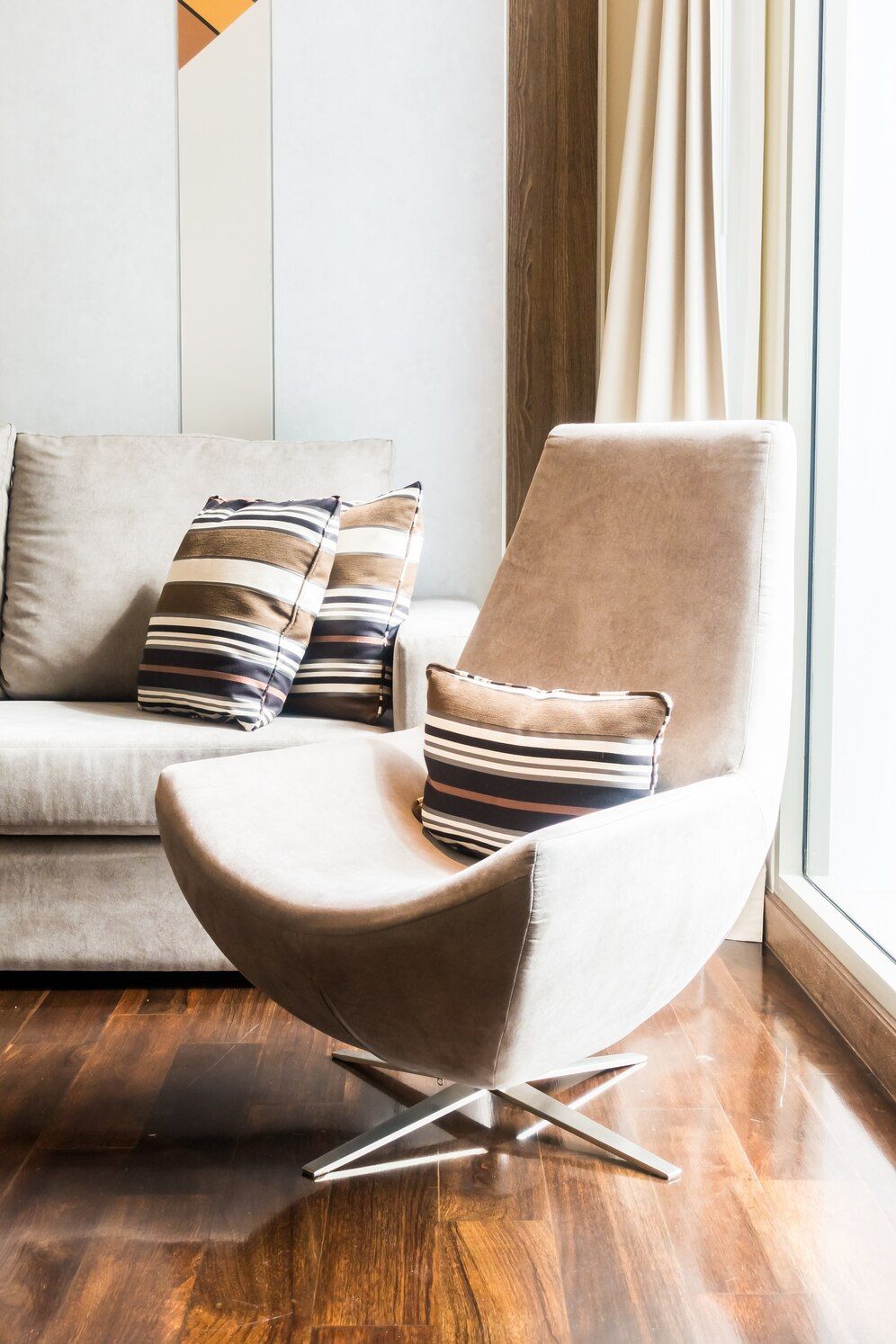 Swivel chair in front of a large window