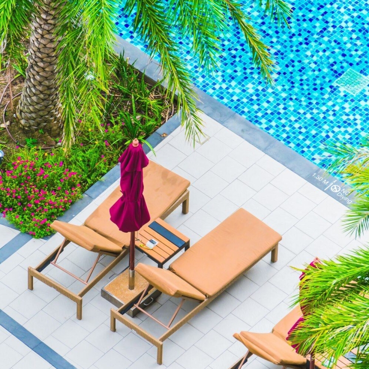 overhead pool view with lounge chairs