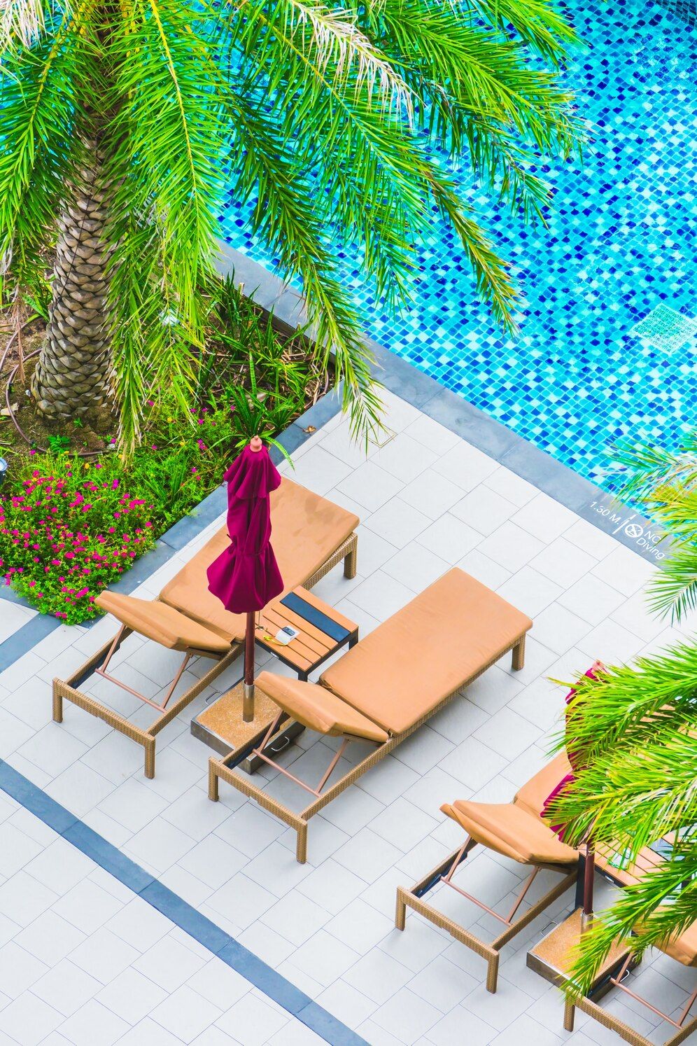 overhead pool view with lounge chairs